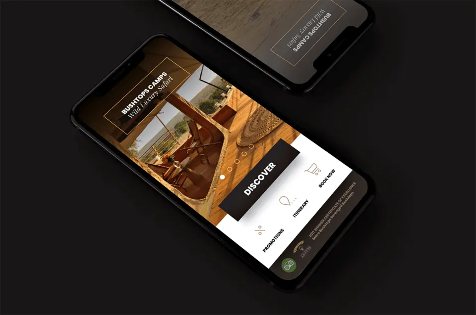 Bushtop Camps luxury safari booking app design on two dark phone mockups with a safari tent interior photo
